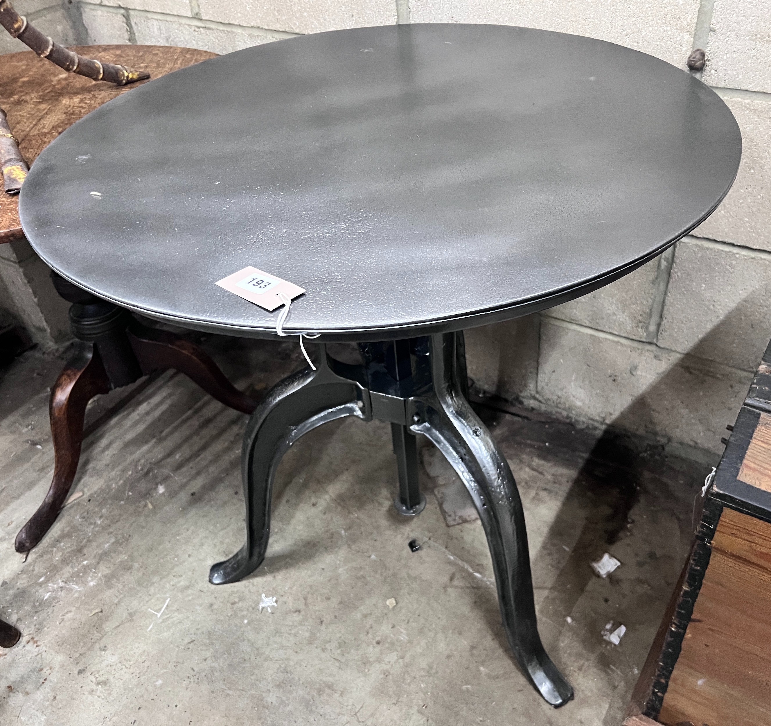 A cast iron and painted metal adjustable circular occasional table, width 75cm *Please note the sale commences at 9am.